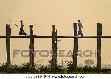 "Locals walking on a teak bridge, U Bein Bridge across Thaungthaman Lake in the evening light, Amarapura, Mandalay Division, Myanmar, Asia" View Large Photo Image Picture - "Locals walking on a teak bridge, U Bein Bridge across Thaungthaman Lake in the evening light, Amarapura, Mandalay Division, Myanmar, Asia". Fotosearch