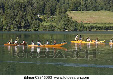 "Locals wearing traditional costumes in decorated wooden Platte boats, Alt-Schlierseer-Kirchtag festival, Schliersee, Upper Bavaria, Bavaria, Germany, Europe" View Large Photo Image Stock Image - "Locals wearing traditional costumes in decorated wooden Platte boats, Alt-Schlierseer-Kirchtag festival, Schliersee, Upper Bavaria, Bavaria, Germany, Europe". Fotosearch