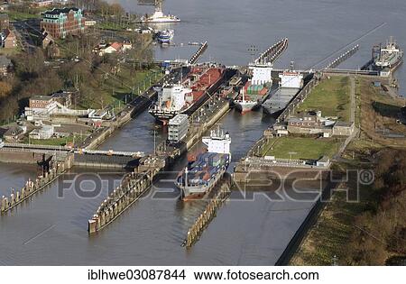 "Lock of the Kiel Canal, German: Nord-Ostsee-Kanal, NOK, aerial photo, Brunsbuttel, Schleswig-Holstein, Germany, Europe" View Large Photo Image Picture - "Lock of the Kiel Canal, German: Nord-Ostsee-Kanal, NOK, aerial photo, Brunsbuttel, Schleswig-Holstein, Germany, Europe". Fotosearch