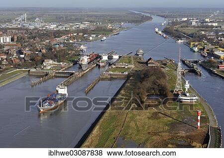 "Lock of the Kiel Canal, German: Nord-Ostsee-Kanal, NOK, aerial photo, Brunsbuttel, Schleswig-Holstein, Germany, Europe" View Large Photo Image Stock Photo - "Lock of the Kiel Canal, German: Nord-Ostsee-Kanal, NOK, aerial photo, Brunsbuttel, Schleswig-Holstein, Germany, Europe". Fotosearch