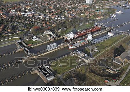 "Lock of the Kiel Canal, German: Nord-Ostsee-Kanal, NOK, aerial photo, Brunsbuttel, Schleswig-Holstein, Germany, Europe" View Large Photo Image Stock Photo - "Lock of the Kiel Canal, German: Nord-Ostsee-Kanal, NOK, aerial photo, Brunsbuttel, Schleswig-Holstein, Germany, Europe". Fotosearch