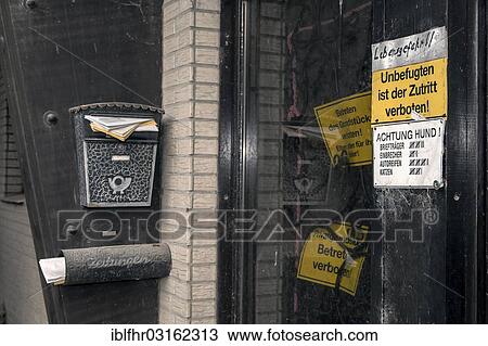 "Locked front door with prohibition signs and an overflowing mailbox, Borschemich, North Rhine-Westphalia, Germany, Europe" View Large Photo Image Stock Image - "Locked front door with prohibition signs and an overflowing mailbox, Borschemich, North Rhine-Westphalia, Germany, Europe". Fotosearch