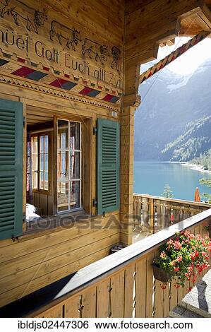 "Log chalet at Oeschinensee, Oeschinen Lake, Bernese Oberland, Canton of Bern, Switzerland, Europe" View Large Photo Image Stock Photograph - "Log chalet at Oeschinensee, Oeschinen Lake, Bernese Oberland, Canton of Bern, Switzerland, Europe". Fotosearch
