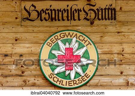 "Logo of the Schliersee mountain rescue service, on the """"Bes'nreisser Hutt'n"""" wooden hut, Spitzingsee, near Schliersee, Upper Bavaria, Bavaria, Germany, Europe" View Large Photo Image Stock Image - "Logo of the Schliersee mountain rescue service, on the """"Bes'nreisser Hutt'n"""" wooden hut, Spitzingsee, near Schliersee, Upper Bavaria, Bavaria, Germany, Europe". Fotosearch