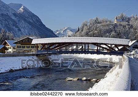 Stock Image - "Loisachbruecke bridge in Eschenlohe, St. Nicholas Chapel, Hoher Fricken Mountain, Alpspitze Mountain, Eschenlohe, Loisach, Loisachtal Valley, Upper Bavaria, Bavaria, Germany, Europe". Fotosearch