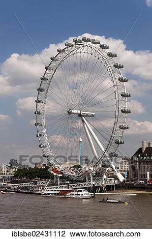 Stock Image - "London Eye Ferris wheel, Thames, cloudy sky, London, England, United Kingdom, Europe". Fotosearch
