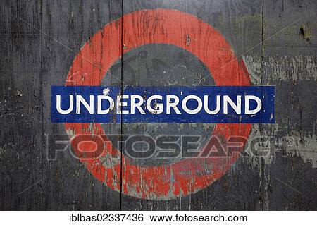 "London Underground logo, weathered sign painted on a wooden fence, Transport for London, London, England, United Kingdom, Europe" View Large Photo Image Stock Photograph - "London Underground logo, weathered sign painted on a wooden fence, Transport for London, London, England, United Kingdom, Europe". Fotosearch