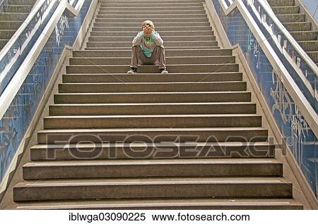 "Lonely boy sitting on a staircase, Cologne, Rhineland, North Rhine-Westphalia, Germany, Europe" View Large Photo Image Stock Photography - "Lonely boy sitting on a staircase, Cologne, Rhineland, North Rhine-Westphalia, Germany, Europe". Fotosearch