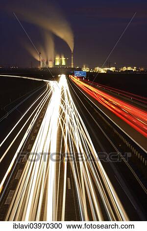 "Long exposure at night, light trails on the A38 motorway, Schkopau power plant at the back, Saxony-Anhalt, Germany, Europe" View Large Photo Image Stock Image - "Long exposure at night, light trails on the A38 motorway, Schkopau power plant at the back, Saxony-Anhalt, Germany, Europe". Fotosearch