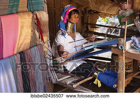 Stock Photo - "Long-necked Padaung woman wearing neck rings weaving a garment, hill tribes, Chiang Rai, Northern Thailand, Thailand, Asia". Fotosearch