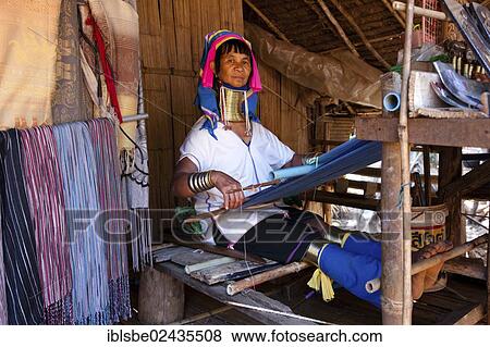 "Long-necked Padaung woman wearing neck rings weaving a garment, hill tribes, Chiang Rai, Northern Thailand, Thailand, Asia" View Large Photo Image Stock Photo - "Long-necked Padaung woman wearing neck rings weaving a garment, hill tribes, Chiang Rai, Northern Thailand, Thailand, Asia". Fotosearch