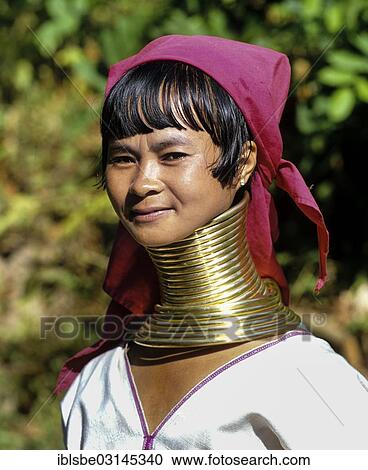 Stock Image - "Long-necked woman of the Padaung mountain tribe, also known as giraffe women, wearing neck rings, Chiang Rai Province, Northern Thailand, Thailand, Asia". Fotosearch