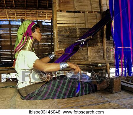 "Long-necked woman of the Padaung mountain tribe, also known as giraffe women, wearing neck rings and weaving at a loom, Chiang Rai Province, Northern Thailand, Thailand, Asia" View Large Photo Image Stock Photograph - "Long-necked woman of the Padaung mountain tribe, also known as giraffe women, wearing neck rings and weaving at a loom, Chiang Rai Province, Northern Thailand, Thailand, Asia". Fotosearch