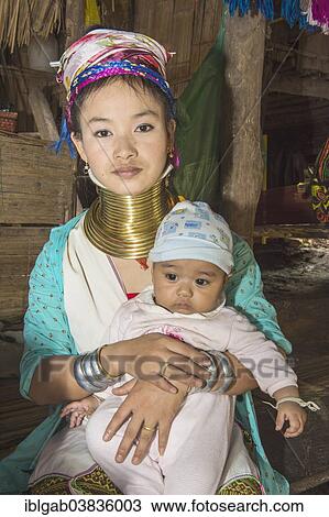 Stock Image - "Long-necked woman with her baby, Karen tribe, Chiang Mai, Thailand, Asia". Fotosearch