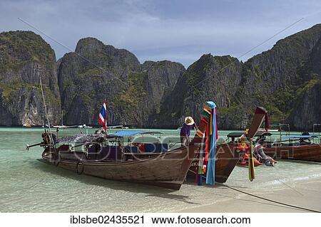 "Longtail boats on the sandy beach of Maya Beach, Ko Phi Phi Island, Phuket, Thailand, Asia" View Large Photo Image Stock Image - "Longtail boats on the sandy beach of Maya Beach, Ko Phi Phi Island, Phuket, Thailand, Asia". Fotosearch
