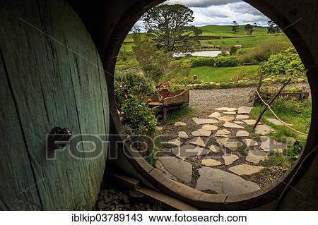 "Looking out of a Hobbit-hole in Hobbiton, location of the Lord of the Rings and The Hobbit film trilogy, Hinuera, Matamata, North Island, New Zealand, Oceania" View Large Photo Image Stock Image - "Looking out of a Hobbit-hole in Hobbiton, location of the Lord of the Rings and The Hobbit film trilogy, Hinuera, Matamata, North Island, New Zealand, Oceania". Fotosearch