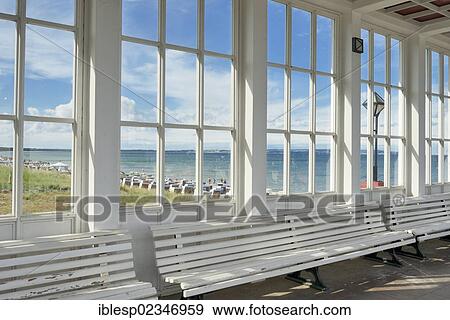 Stock Photo - "Looking through the window of the pavilion of the Kurhaus spa building towards the Baltic Sea and the beach, Baltic Sea resort town of Binz, Binz, Rugen, Mecklenburg-Western Pomerania, Germany, Europe". Fotosearch