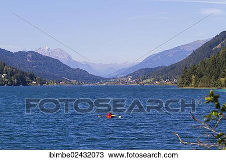 "Looking west over the deep blue waters of Weissensee lake, Carinthia, Austria, Europe" View Large Photo Image Stock Image - "Looking west over the deep blue waters of Weissensee lake, Carinthia, Austria, Europe". Fotosearch