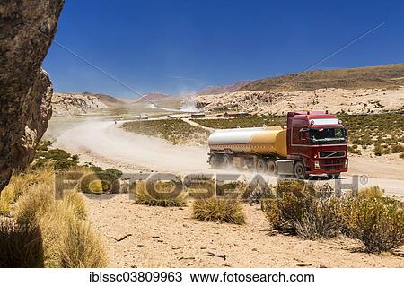 Stock Image - "Lorry on a road in the Altiplano, Andean Plateau, Andes, Bolivia, South America". Fotosearch