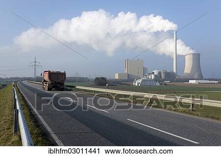 "Lorry on a two-lane highway travelling in front of steam rising from a cooling tower and a chimney of Petershagen-Lahde coal-fired power station, Minden Lubbecke, Petershagen, North Rhine-Westphalia, Germany, Europe" View Large Photo Image Stock Image - "Lorry on a two-lane highway travelling in front of steam rising from a cooling tower and a chimney of Petershagen-Lahde coal-fired power station, Minden Lubbecke, Petershagen, North Rhine-Westphalia, Germany, Europe". Fotosearch