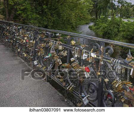 Stock Image - "Love locks on the bridge over the Vilnia River, Senamiestis or Vilnius Old Town, Vilnius, Vilnius district, Lithuania, Europe". Fotosearch