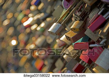 "Love padlocks as a sign of devotion, Hohenzollern Bridge, Cologne, Rhineland, North Rhine-Westphalia, Germany, Europe" View Large Photo Image Stock Image - "Love padlocks as a sign of devotion, Hohenzollern Bridge, Cologne, Rhineland, North Rhine-Westphalia, Germany, Europe". Fotosearch