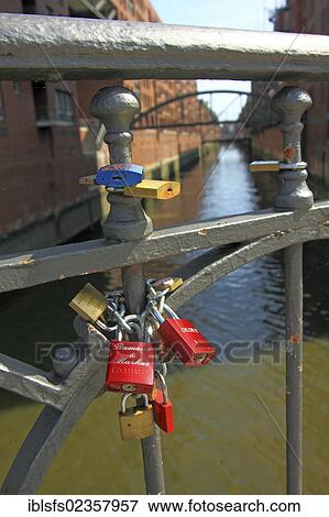 "Love padlocks on a bridge railing, bridge over a canal in Speicherstadt, the historic warehouse district, Hanseatic City of Hamburg, Germany, Europe" View Large Photo Image Stock Photo - "Love padlocks on a bridge railing, bridge over a canal in Speicherstadt, the historic warehouse district, Hanseatic City of Hamburg, Germany, Europe". Fotosearch