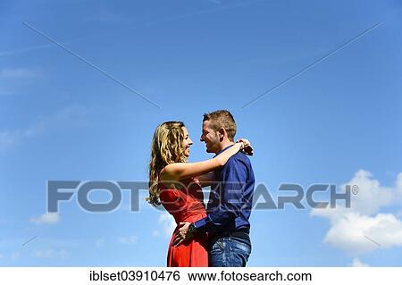 Stock Photograph - "Lovers against a blue sky, Austria, Europe". Fotosearch
