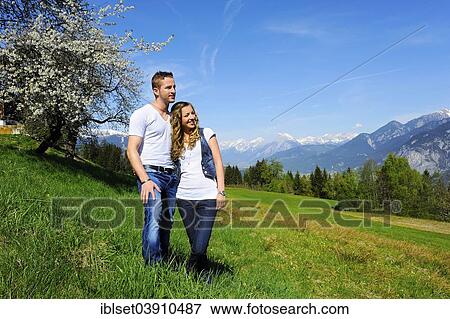 "Lovers in the spring, flowering tree and mountains at the back, Gotzens, Tyrol, Austria, Europe" View Large Photo Image Stock Photo - "Lovers in the spring, flowering tree and mountains at the back, Gotzens, Tyrol, Austria, Europe". Fotosearch