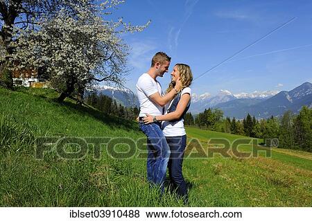 "Lovers in the spring, flowering tree and mountains at the back, Gotzens, Tyrol, Austria, Europe" View Large Photo Image Stock Photo - "Lovers in the spring, flowering tree and mountains at the back, Gotzens, Tyrol, Austria, Europe". Fotosearch