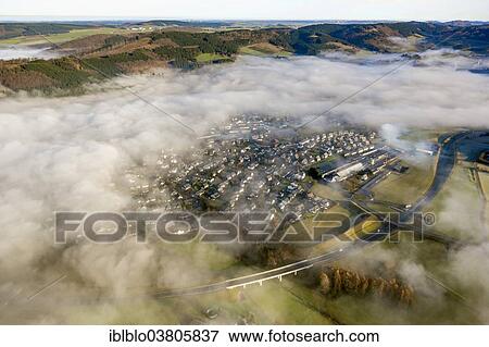 "Low clouds over Olsberg, aerial view, Sauerland region, North Rhine-Westphalia, Germany, Europe" View Large Photo Image Stock Photo - "Low clouds over Olsberg, aerial view, Sauerland region, North Rhine-Westphalia, Germany, Europe". Fotosearch