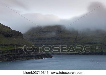 "Low hanging clouds over a fjord, Streymoy, Faroe Islands, Denmark, Europe" View Large Photo Image Stock Photograph - "Low hanging clouds over a fjord, Streymoy, Faroe Islands, Denmark, Europe". Fotosearch