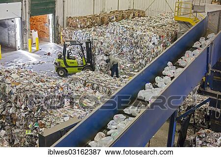 "Low-wage workers sort paper, glass, plastic, and metals for recycling, recycling centre of the Southeastern Oakland County Resource Recovery Authority (SOCRRA), Troy, Michigan, United States, North America" View Large Photo Image Stock Photo - "Low-wage workers sort paper, glass, plastic, and metals for recycling, recycling centre of the Southeastern Oakland County Resource Recovery Authority (SOCRRA), Troy, Michigan, United States, North America". Fotosearch