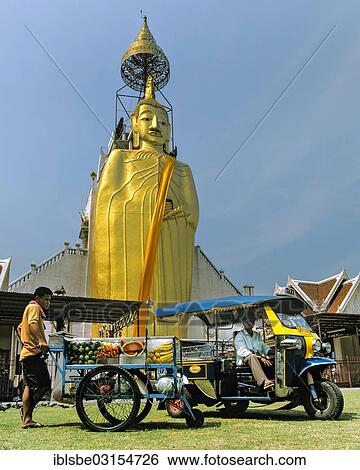 "Luang Pho Tho, 32 m tall Buddha statue of Wat Intharawihan, Wat Indra, tuk tuk, Bangkok, Central Thailand, Thailand, Asia" View Large Photo Image Stock Photograph - "Luang Pho Tho, 32 m tall Buddha statue of Wat Intharawihan, Wat Indra, tuk tuk, Bangkok, Central Thailand, Thailand, Asia". Fotosearch