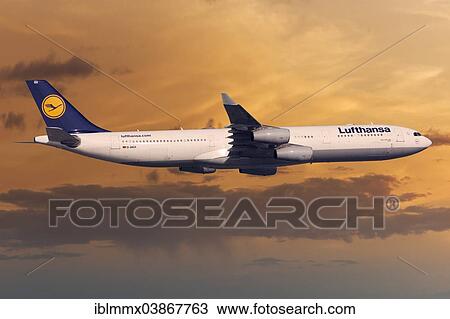 Stock Image - Lufthansa Airbus A330-343 in flight in the evening light. Fotosearch
