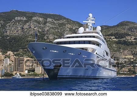 Lurssen motor yacht Saint Nicolas at anchor in front of the Principality of Monaco View Large Photo Image Stock Photo - Lurssen motor yacht Saint Nicolas at anchor in front of the Principality of Monaco. Fotosearch