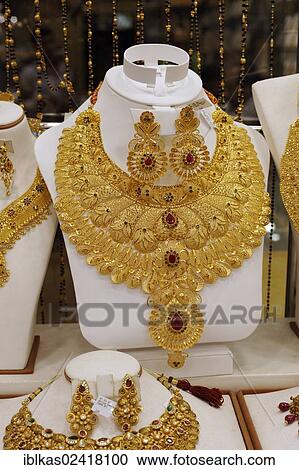 Lush gold necklace, Indian style, based upon ancient models, Gold Souk, Deira, Dubai, United Arab Emirates, Middle East, Asia View Large Photo Image Stock Image - Lush gold necklace, Indian style, based upon ancient models, Gold Souk, Deira, Dubai, United Arab Emirates, Middle East, Asia. Fotosearch