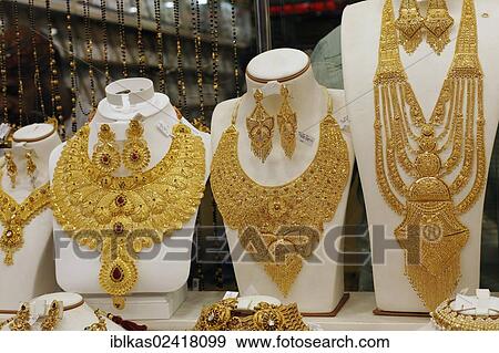 Lush gold necklaces, Indian style, based upon ancient models, Gold Souk, Deira, Dubai, United Arab Emirates, Middle East, Asia View Large Photo Image Stock Photo - Lush gold necklaces, Indian style, based upon ancient models, Gold Souk, Deira, Dubai, United Arab Emirates, Middle East, Asia. Fotosearch