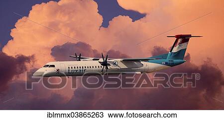 Luxair De Havilland Canada DHC-8-402Q Dash 8 in flight during a thunderstorm View Large Photo Image Stock Image - Luxair De Havilland Canada DHC-8-402Q Dash 8 in flight during a thunderstorm. Fotosearch