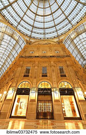 Stock Photography - "Luxury shopping arcade, roofed gallery of Galleria Vittorio Emanuele II, twilight shot at the blue hour, Milan, Lombardy, Italy, Europe". Fotosearch