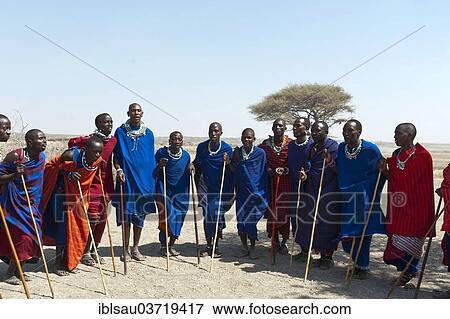 "Maasai, group of men and women dancing, Ngorongoro Conservation Area, Kiloki, Tanzania, Africa" View Large Photo Image Stock Photo - "Maasai, group of men and women dancing, Ngorongoro Conservation Area, Kiloki, Tanzania, Africa". Fotosearch