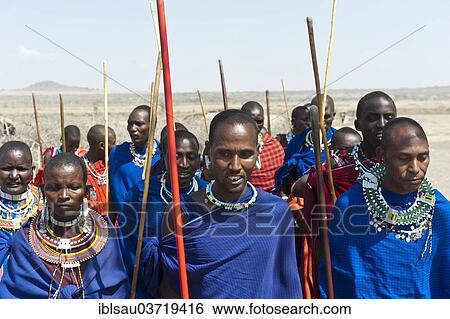 "Maasai, group of men and women, Ngorongoro Conservation Area, Kiloki, Tanzania, Africa" View Large Photo Image Stock Photograph - "Maasai, group of men and women, Ngorongoro Conservation Area, Kiloki, Tanzania, Africa". Fotosearch