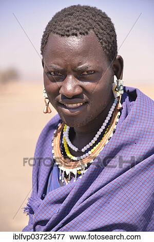 Stock Photo - "Maasai man wearing traditional dress, Ngorongoro Conservation Area, Ndema, Tanzania, Africa". Fotosearch