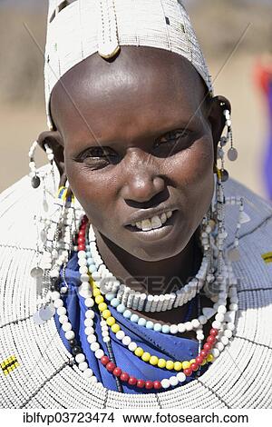 "Maasai woman wearing traditional jewellery, Ngorongoro Conservation Area, Ndema, Tanzania, Africa" View Large Photo Image Picture - "Maasai woman wearing traditional jewellery, Ngorongoro Conservation Area, Ndema, Tanzania, Africa". Fotosearch