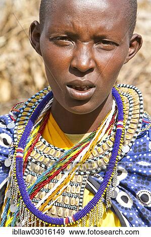 "Maasai woman wearing traditional dress, portrait, Massai Mara, Distrikt Narok, Serengeti, Rift Valley province, Kenya, Africa" View Large Photo Image Stock Photo - "Maasai woman wearing traditional dress, portrait, Massai Mara, Distrikt Narok, Serengeti, Rift Valley province, Kenya, Africa". Fotosearch