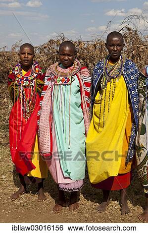 "Maasai women wearing traditional dress and traditional jewellery, Massai Mara, Distrikt Narok, Serengeti, Rift Valley province, Kenya, Africa" View Large Photo Image Stock Photograph - "Maasai women wearing traditional dress and traditional jewellery, Massai Mara, Distrikt Narok, Serengeti, Rift Valley province, Kenya, Africa". Fotosearch
