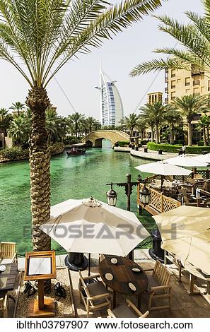 Stock Photo - "Madinat Jumeirah, Arabian Resort, Burj al Arab hotel at back, Umm Suqeim 3, Dubai, United Arab Emirates, Asia". Fotosearch