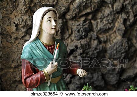 "Madonna figure holding a candle, detailed view, in a grotto near the Church of St. Kunigund, Schnaittach, Middle Franconia, Bavaria, Germany, Europe" View Large Photo Image Stock Photo - "Madonna figure holding a candle, detailed view, in a grotto near the Church of St. Kunigund, Schnaittach, Middle Franconia, Bavaria, Germany, Europe". Fotosearch