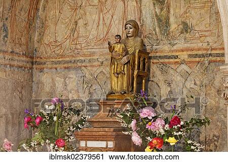 Stock Image - "Madonna Notre Dame la Brune, The Brown Madonna, made of cedar in the early 12th century, Abbey Church of St. Philibert, Burgundy region, department of Saone-et-Loire, France, Europe". Fotosearch