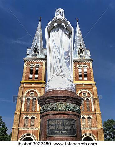 Stock Image - "Madonna statue, Virgin Mary, in front of the neo-Romanesque Notre Dame Cathedral, Saigon, Ho-Chi-Minh-Stadt, Sudvietnam, Vietnam, Asia". Fotosearch